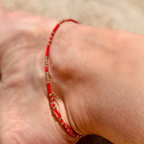 Red anklet close up
